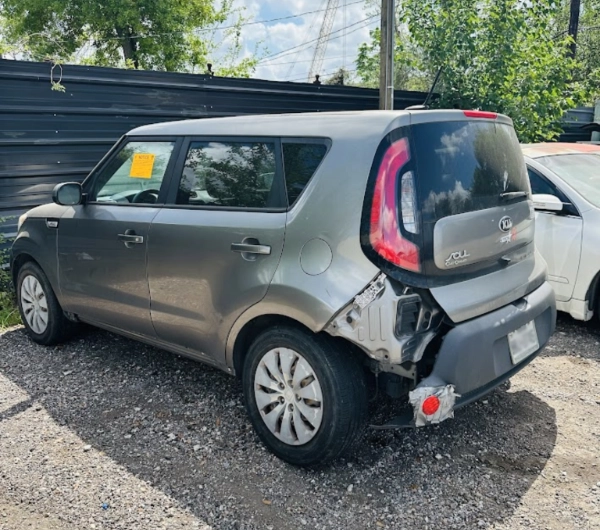 Damaged kia soul in Houston lot ready to be sold as junk car with free towing